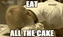 Man eating cake face first