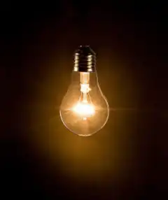 glowing light bulb in dark