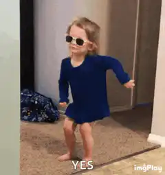 Toddler dancing in sunglasses