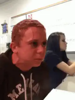 Boy staring at girl in class