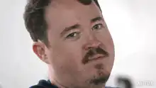 Man tilting head with skeptical look