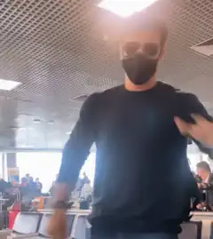 Man in mask and sunglasses dancing