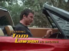 Tom Selleck driving red Ferrari
