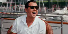 Leonardo DiCaprio laughing on a boat