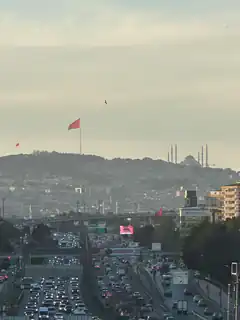 Istanbul traffic with Turkish flag and mosque