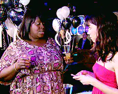 Woman chugging a shot at a party