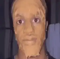 Man with thick mud face mask