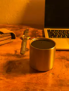 coffee cup on desk with laptop