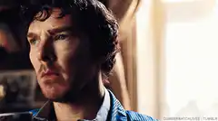Sherlock Holmes looks confused and drinks