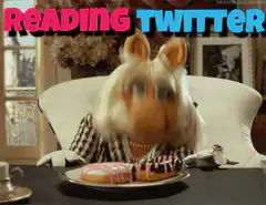 Miss Piggy reading Twitter