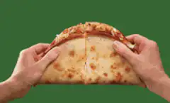 Hands pulling apart cheesy pizza