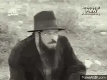 Man in hat laughing hysterically