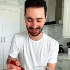 Man excitedly shows whisked batter