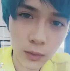 Close-up of a person with blue hair