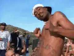Tupac Shakur dancing shirtless