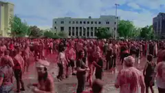crowd covered in red powder