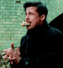 Brad Pitt eating a donut