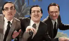 Three men in suits making funny faces