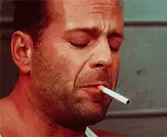 Bruce Willis lights a cigarette