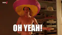 Shirtless man in sombrero shouting tequila