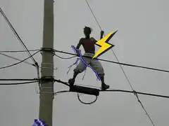 Man dancing on power lines with lightning effects