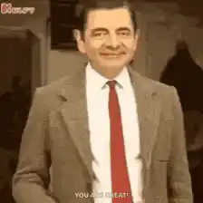 Mr. Bean gives a thumbs up and points