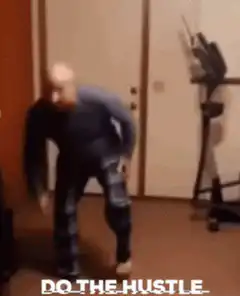 bald man doing the hustle dance