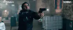 Man points gun at another man's face