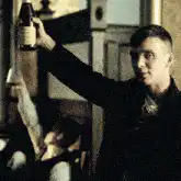 Tommy Shelby raises a bottle