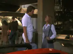 Tom Selleck smiles at a woman