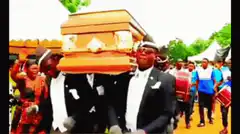 Dancing pallbearers carrying coffin