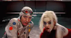 Harley Quinn and Joker kiss under falling ice
