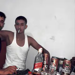 man smoking with whiskey and beer