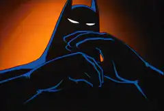 Batman thinking with hands clasped