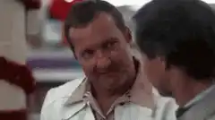 Ray Winstone winking and smiling