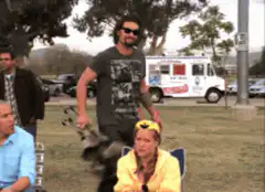 Keanu Reeves lifts chair in park