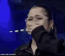 Woman crying on stage