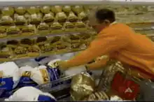 man grabbing bread in grocery store