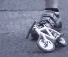 Cyclist rides tiny bike