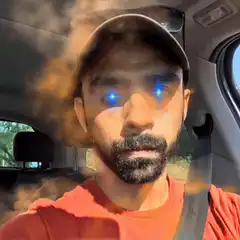 Man with glowing blue eyes and smoke