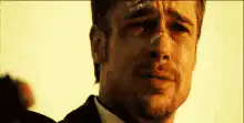 Brad Pitt pointing gun crying