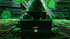 hacker in hoodie with bitcoin