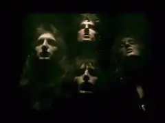 Queen band members singing