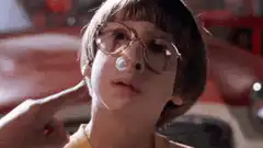 Boy with bubblegum bubble popped