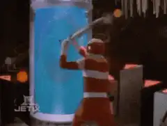 Red Ranger smashes blue cylinder