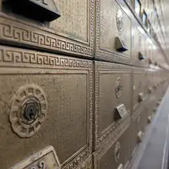 Close-up of ornate brass mailboxes