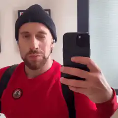 Man winking in mirror selfie