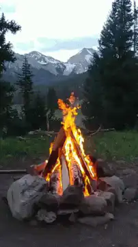campfire burning in mountains