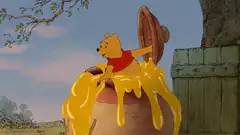 Winnie the Pooh falls in honey pot