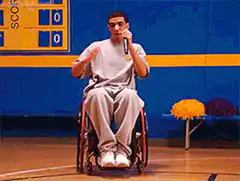 Man in wheelchair singing on stage